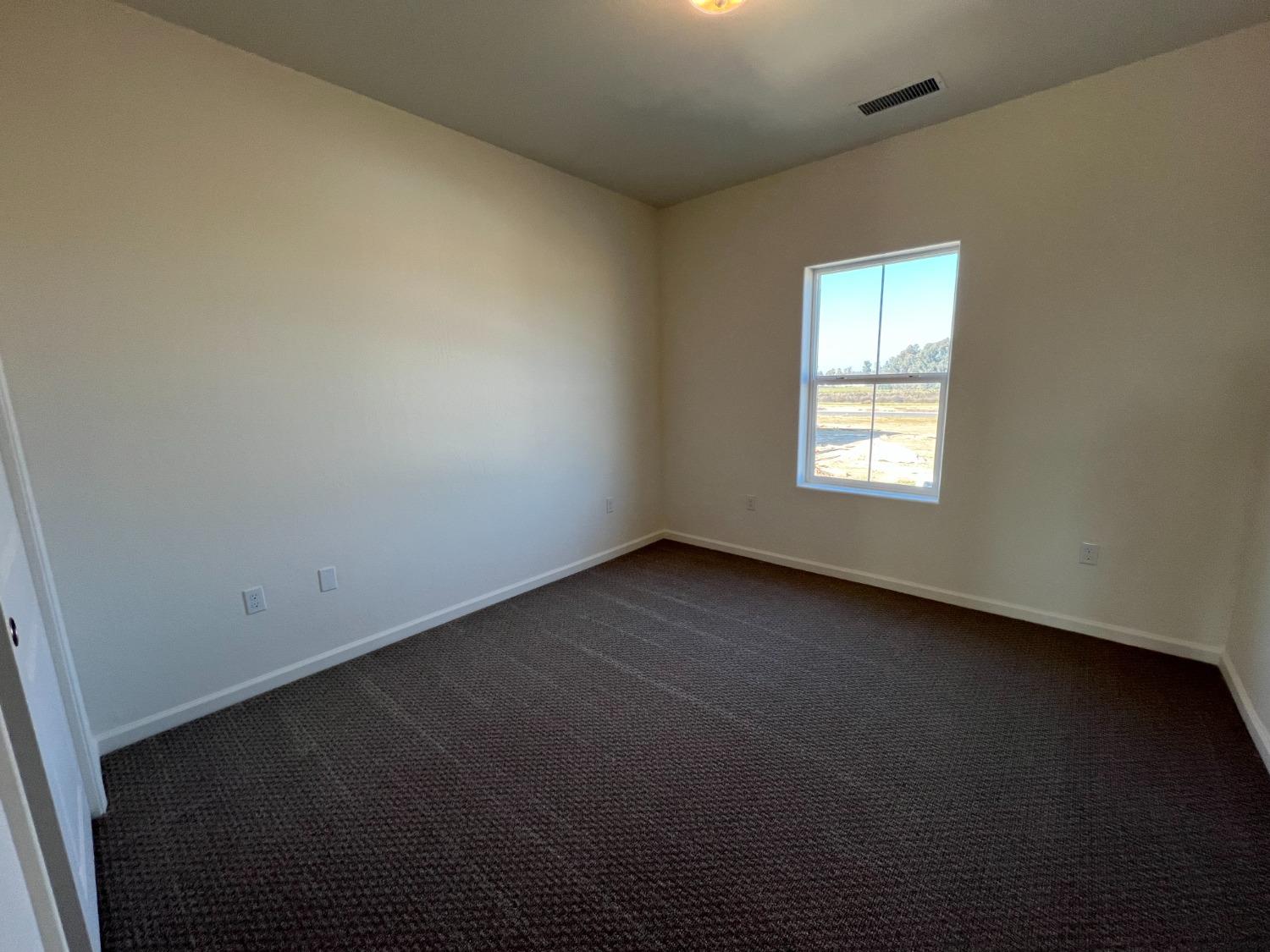 1420 Concord Way Dinuba, CA 93618 - Photo 11 of 16 an empty room with a window