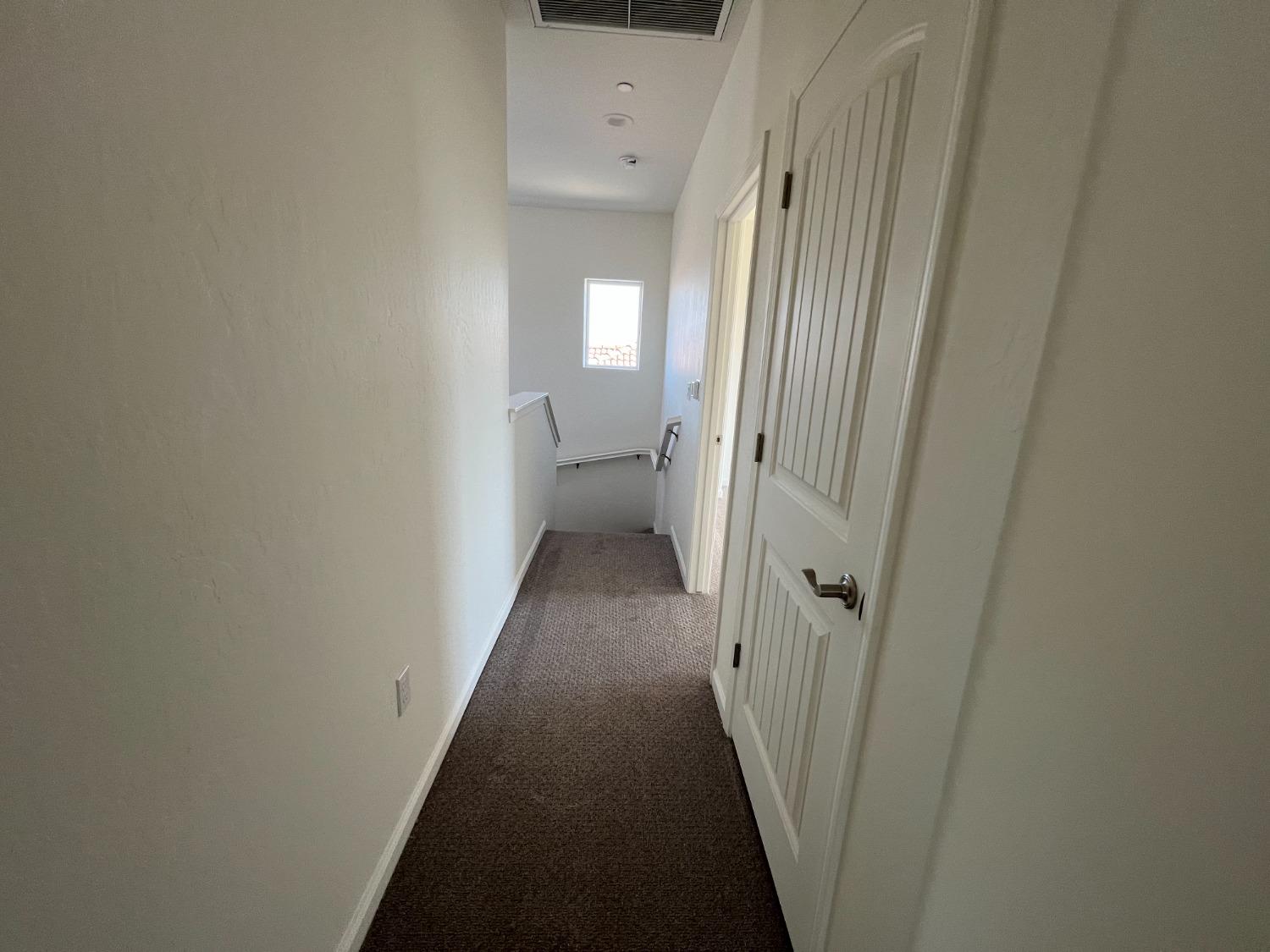 1420 Concord Way Dinuba, CA 93618 - Photo 13 of 16 a view of a hallway with a door