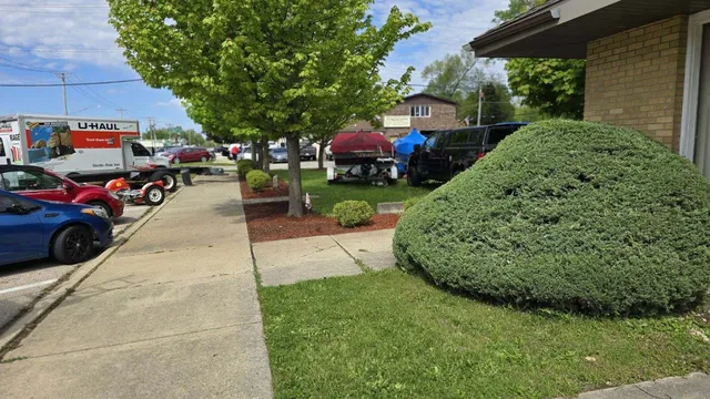 a view of a yard with cars