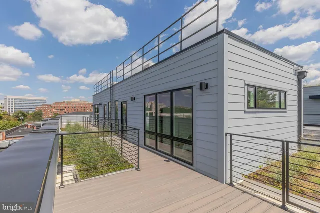 a view of balcony with wooden floor and city view