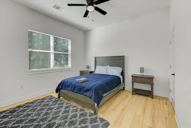 a bedroom with a bed and window