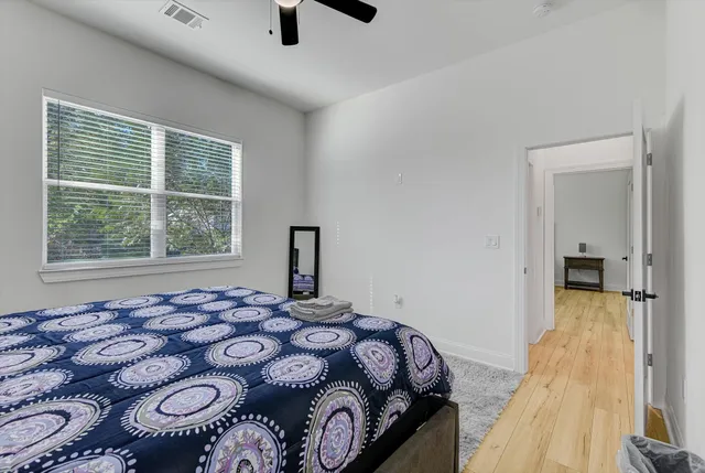 a bedroom with a bed and a window