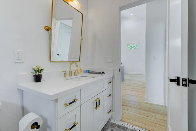a bathroom with a sink and a mirror