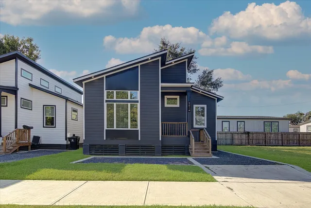 a front view of a house with garden