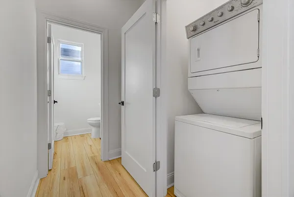 a view of bathroom with a washer and dryer