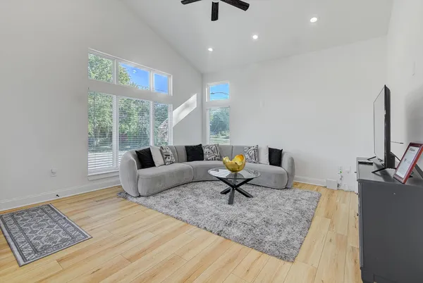 a living room with furniture and a flat screen tv
