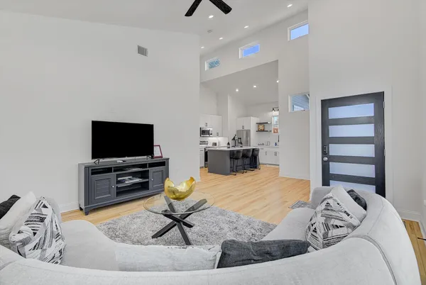a living room with furniture and a flat screen tv
