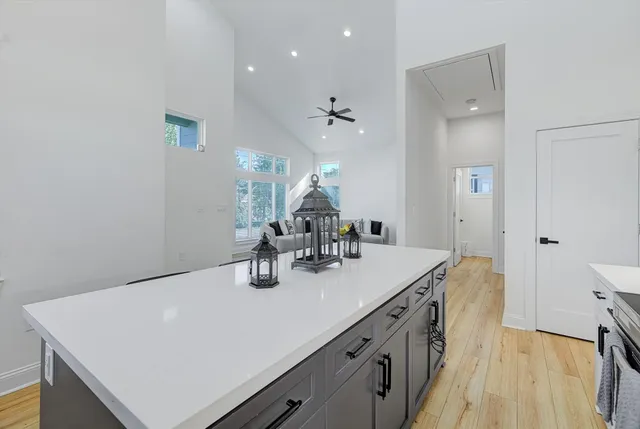 a bathroom with a sink vanity granite and a mirror