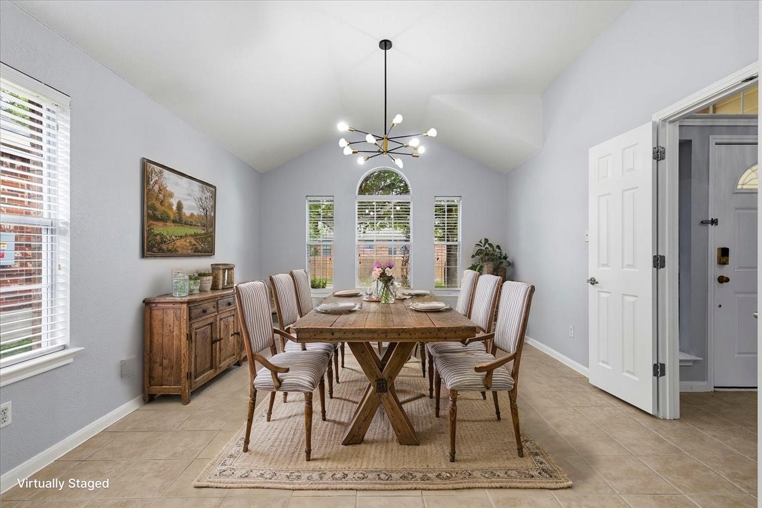 17812 Masi Loop Pflugerville, TX 78660 - Photo 7 of 38 Vaulted ceiling dining area featuring tile flooring and multiple window exposures