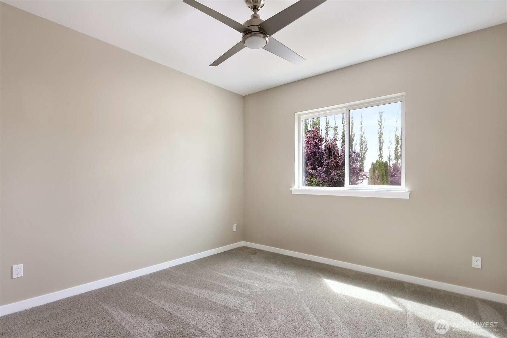 1515 North Waugh Road, Unit B Mount Vernon, WA 98273 - Photo 19 of 28 an empty room with a window and a ceiling fan