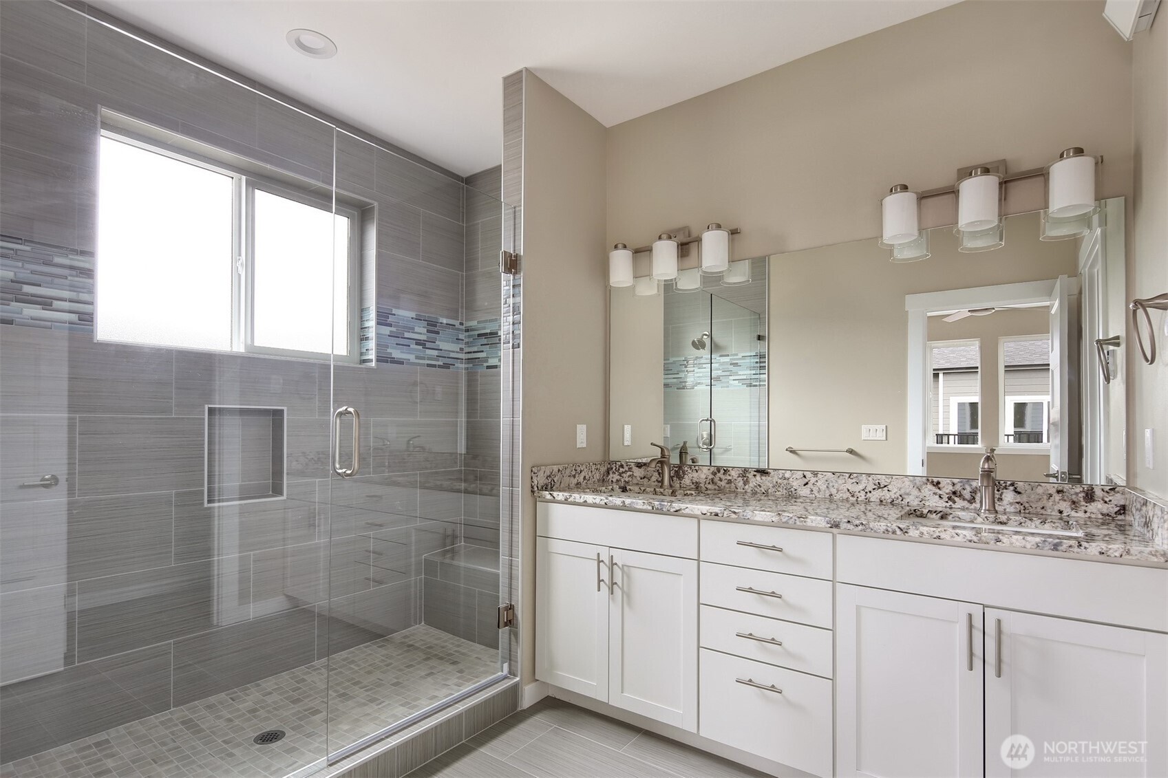 1515 North Waugh Road, Unit B Mount Vernon, WA 98273 - Photo 26 of 28 a bathroom with a shower sink and mirror