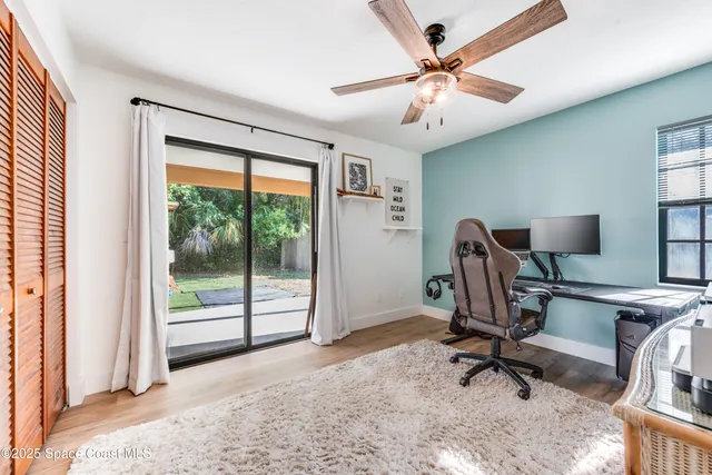 a view of a house with a backyard