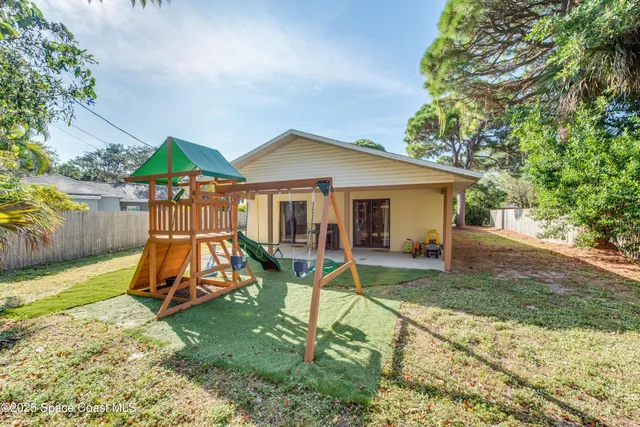 a view of a yard with potted plants