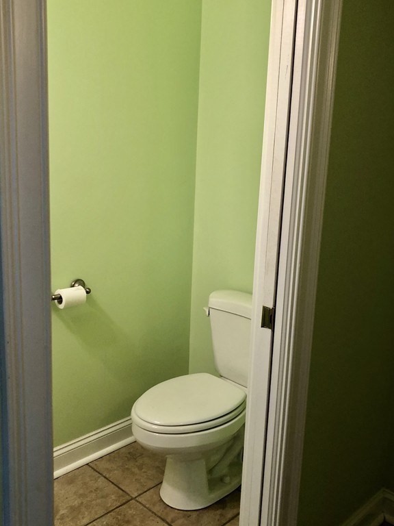 355 Maple Street West Boylston, MA 01583 - Photo 24 of 42 a white toilet sitting next to a small sink