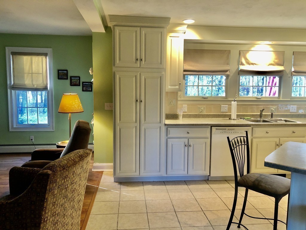 355 Maple Street West Boylston, MA 01583 - Photo 26 of 42 a living room with furniture a window and chandelier
