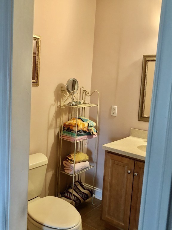355 Maple Street West Boylston, MA 01583 - Photo 30 of 42 a bathroom with a sink mirror vanity and toilet