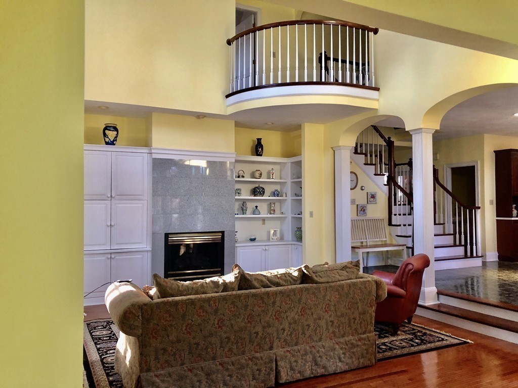 355 Maple Street West Boylston, MA 01583 - Photo 6 of 42 a living room with furniture and a fireplace
