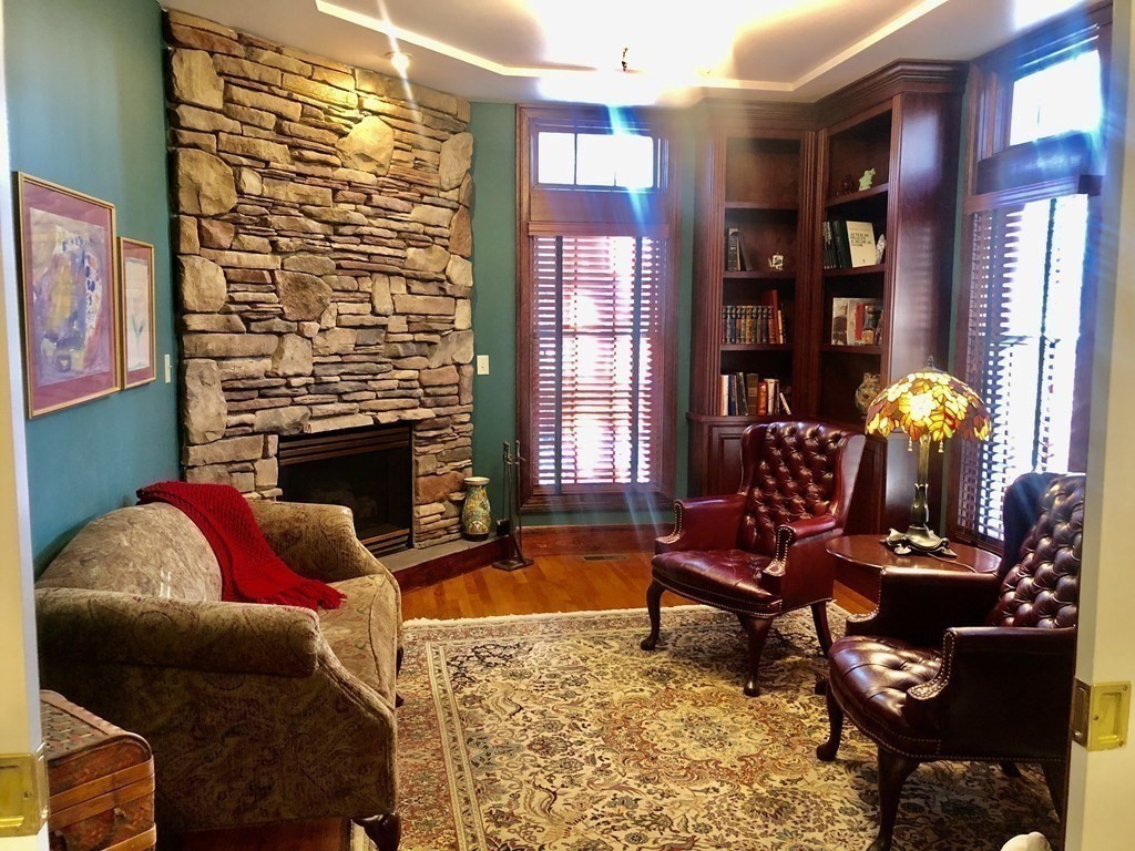 355 Maple Street West Boylston, MA 01583 - Photo 7 of 42 a living room with furniture and a fireplace