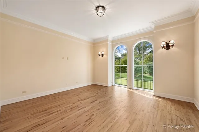 a kitchen with stainless steel appliances granite countertop a stove and a large window