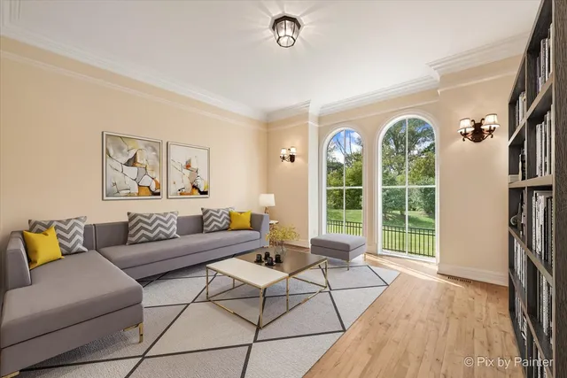 a kitchen with stainless steel appliances granite countertop a refrigerator a sink dishwasher a stove and a dining table with wooden floor