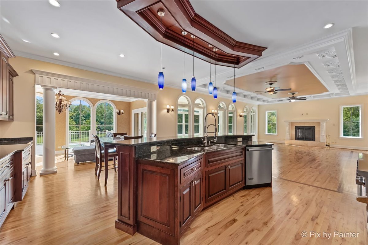 27 West Onwentsia Road Lake Forest, IL 60045 - Photo 21 of 84 a kitchen with stainless steel appliances granite countertop a stove and a large window