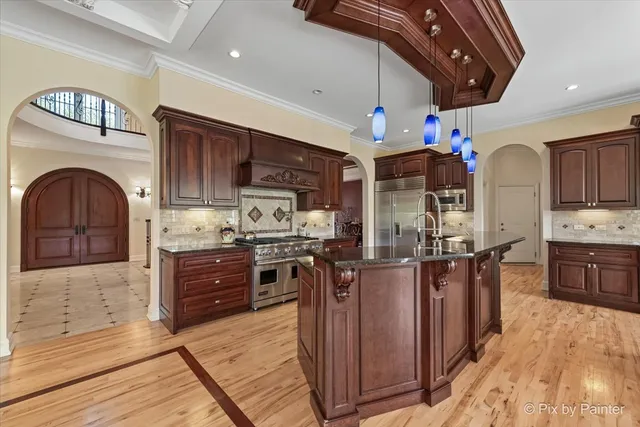 a view of entryway dining room and hall with wooden floor