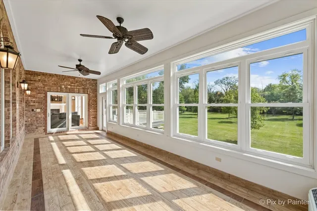 a view of a balcony with wooden floor