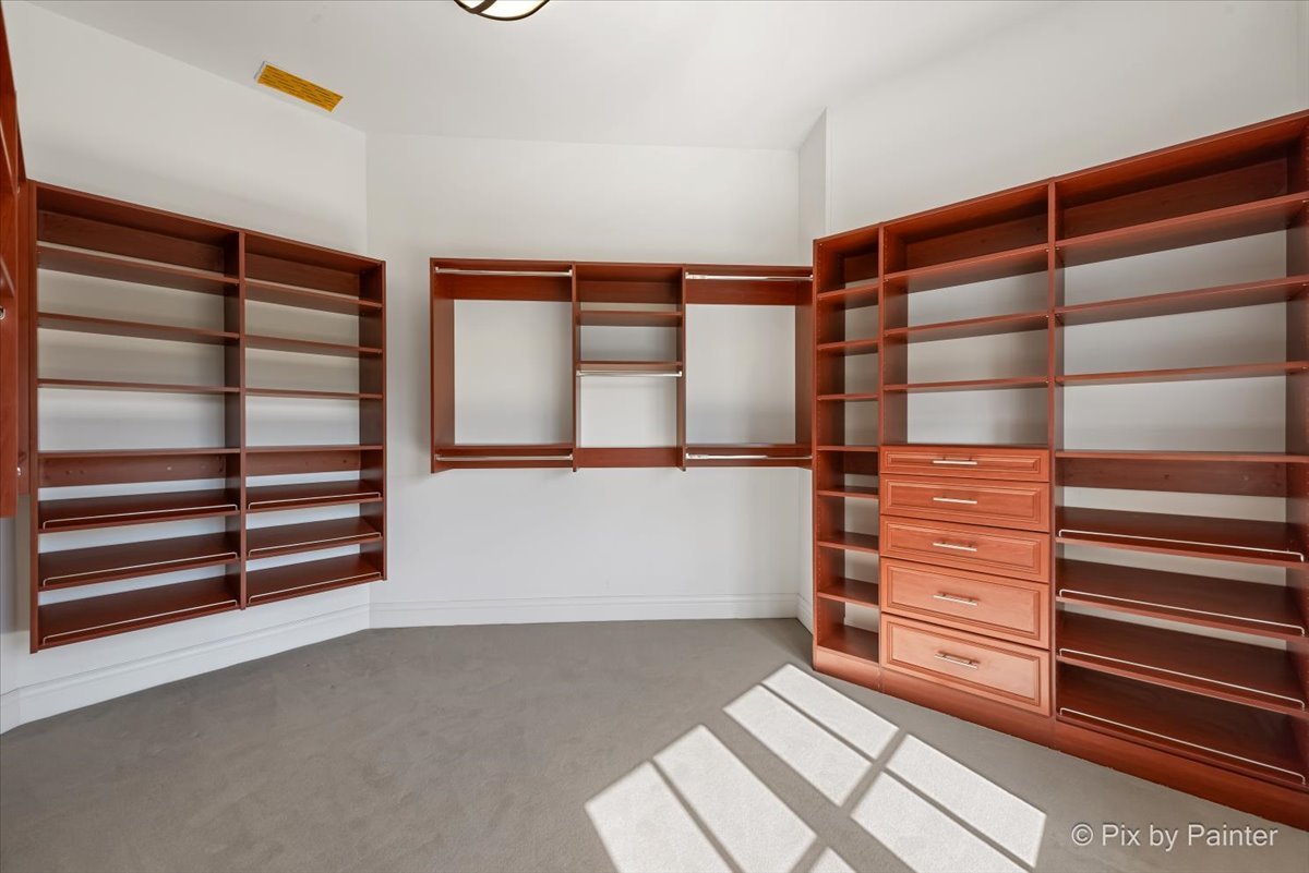 27 West Onwentsia Road Lake Forest, IL 60045 - Photo 55 of 84 a view of walk in closet with empty racks