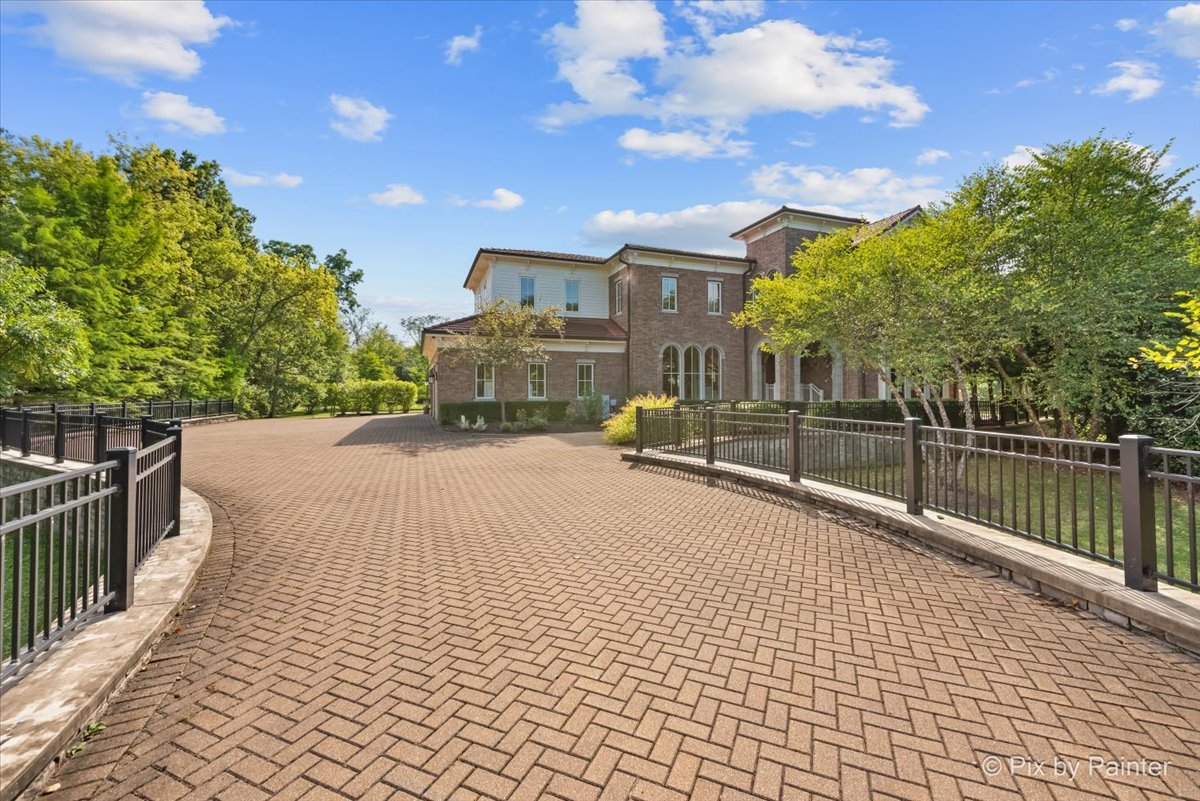 27 West Onwentsia Road Lake Forest, IL 60045 - Photo 74 of 84 a view of a brick house with a large trees