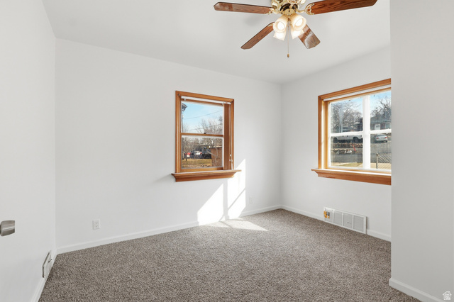 871 North 700 East Logan, UT 84321 - Photo 8 of 20 Carpeted empty room featuring ceiling fan and baseboards