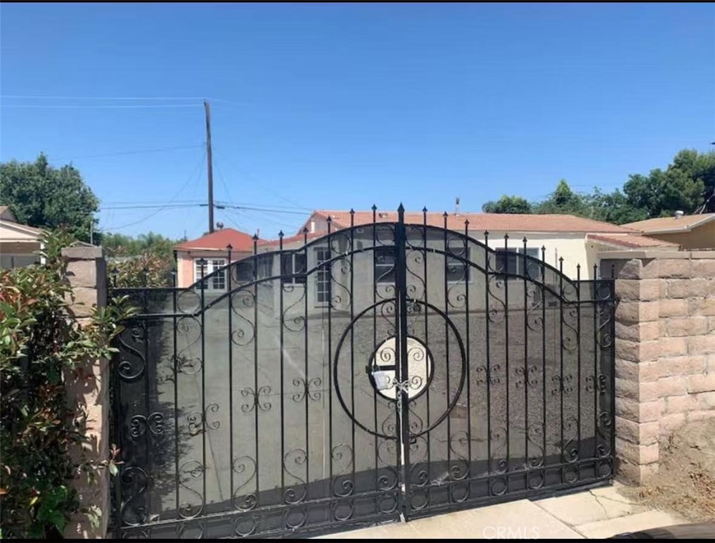 12964 Roswell Avenue Chino, CA 91710 - Photo 1 of 14 a front view of a house with a garden