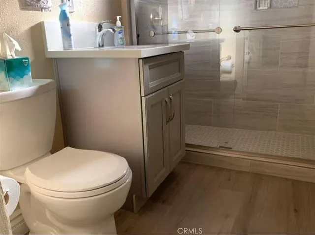 a white toilet sitting next to a bathroom sink