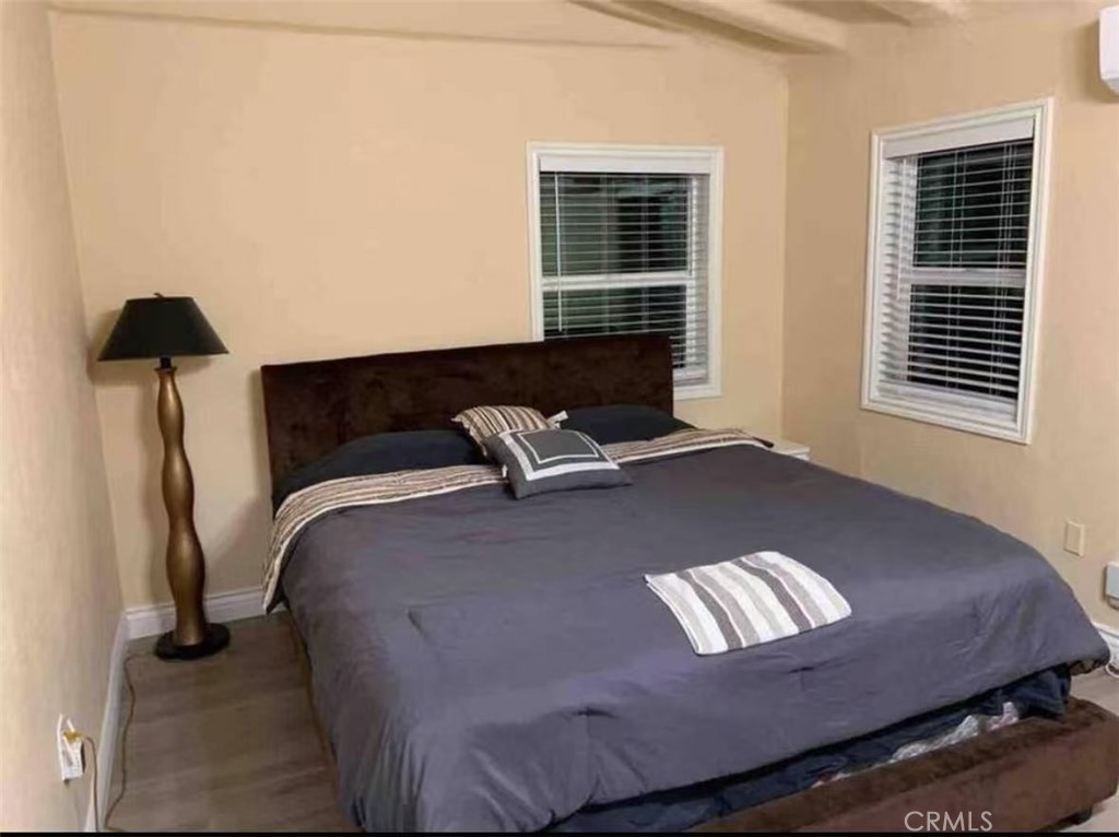 12964 Roswell Avenue Chino, CA 91710 - Photo 14 of 14 a bed sitting in a bedroom next to a window