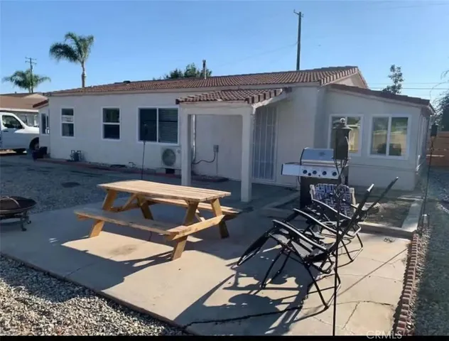 a front view of a house with patio