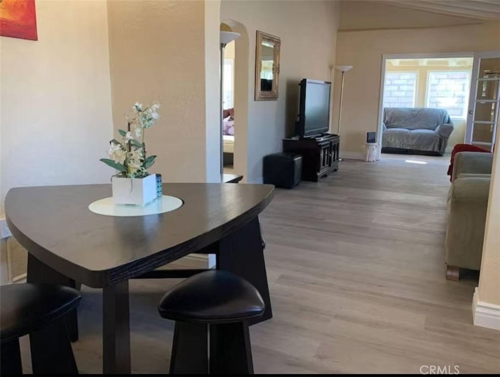 12964 Roswell Avenue Chino, CA 91710 - Photo 5 of 14 a dining room with furniture and wooden floor