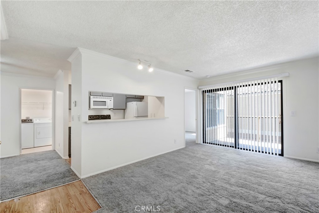 a view of a big room with windows and cabinet