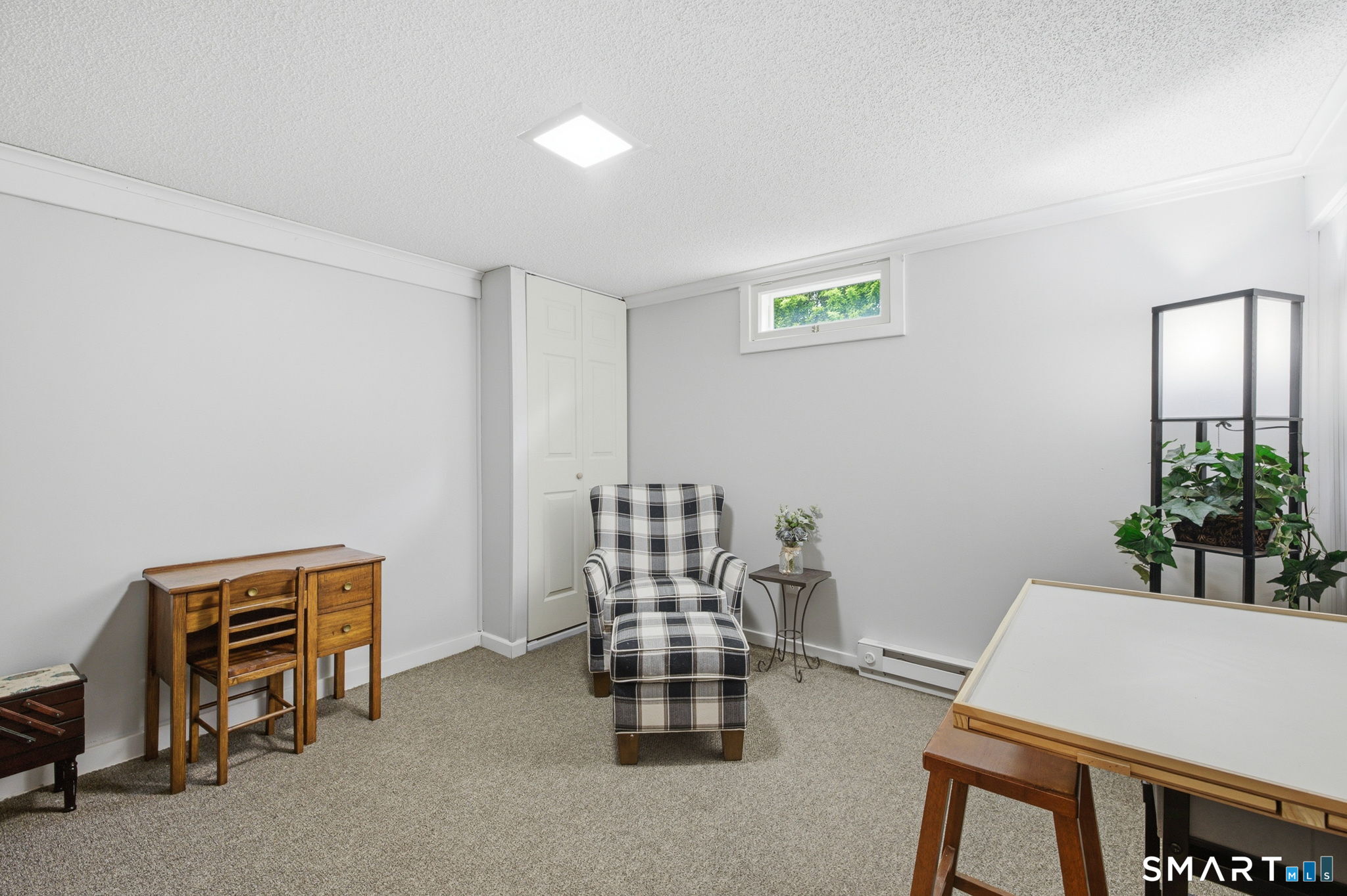 7 Stardust Drive Enfield, CT 06082 - Photo 24 of 38 a room with furniture and a potted plant