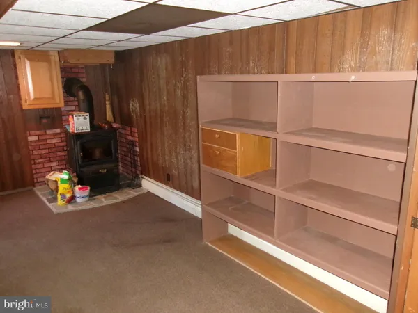 a view of a room with wooden shelves