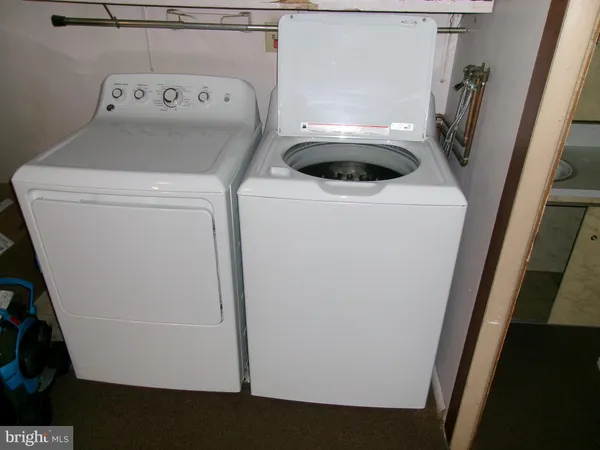 a bathroom with a toilet and a sink