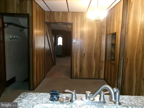 a bathroom with a sink a mirror and shower
