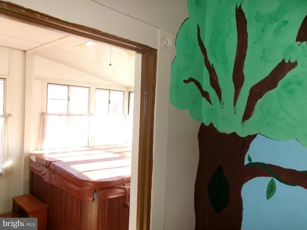 a vase of flowers sitting on a table next to a window
