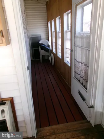 a view of balcony and wooden floor
