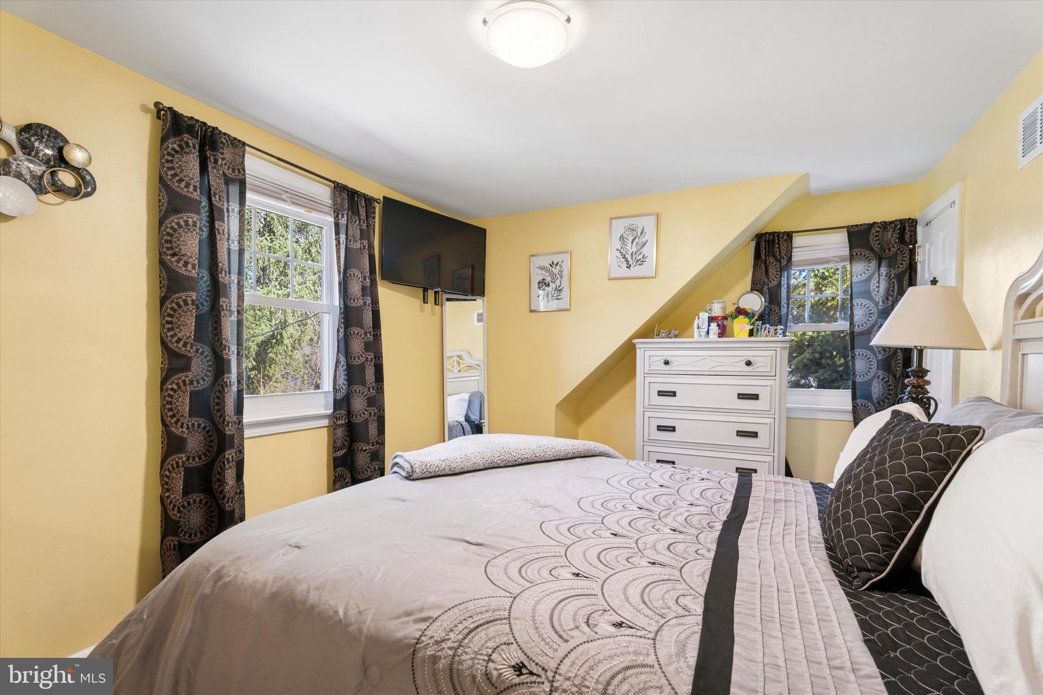 527 Arbor Road Cheltenham, PA 19012 - Photo 20 of 25 a bedroom with a large bed and a window
