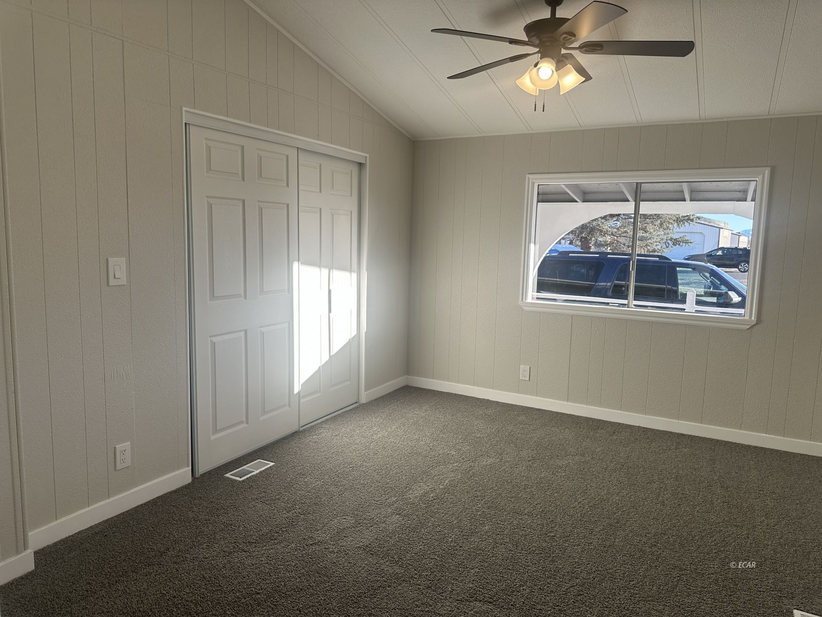 940 Spring Valley Parkway Spring Creek, NV 89815 - Photo 17 of 25 an empty room with windows and fan