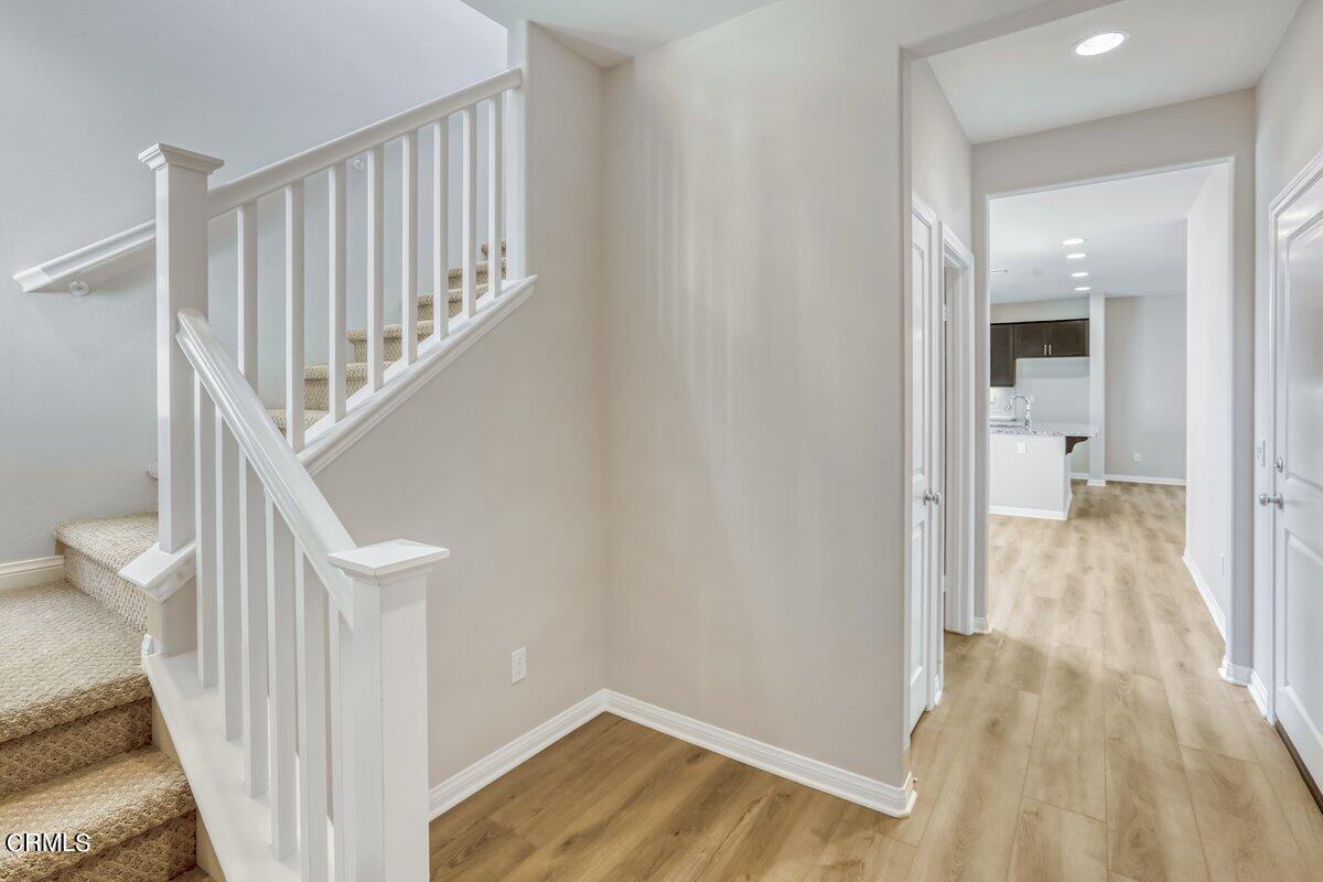 225 Stonegate Road Camarillo, CA 93010 - Photo 4 of 32 a view of a hallway with wooden floor and entryway