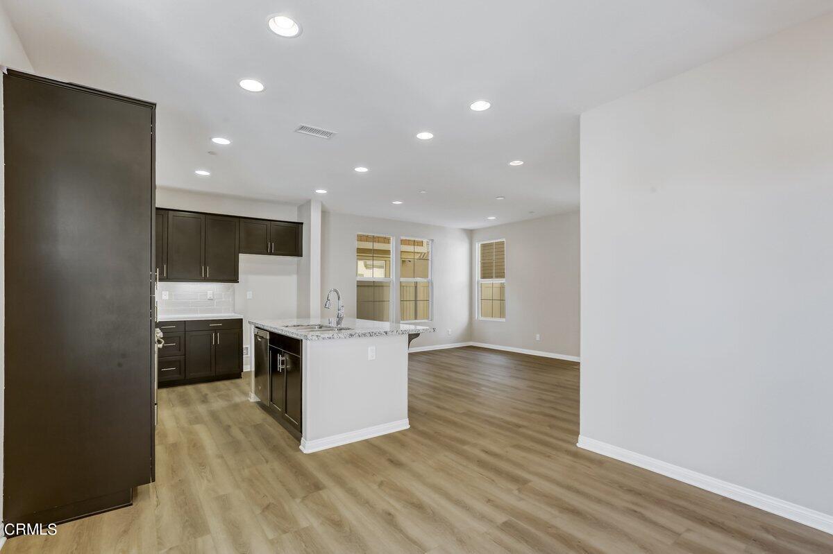225 Stonegate Road Camarillo, CA 93010 - Photo 5 of 32 a view of kitchen with cabinets and wooden floor