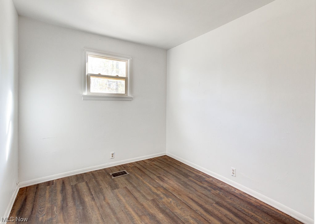 4728 Davis Road Perry, OH 44081 - Photo 7 of 18 Spare room with dark hardwood / wood-style flooring