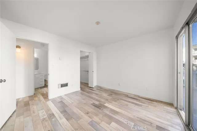 a kitchen with granite countertop a sink stove and refrigerator