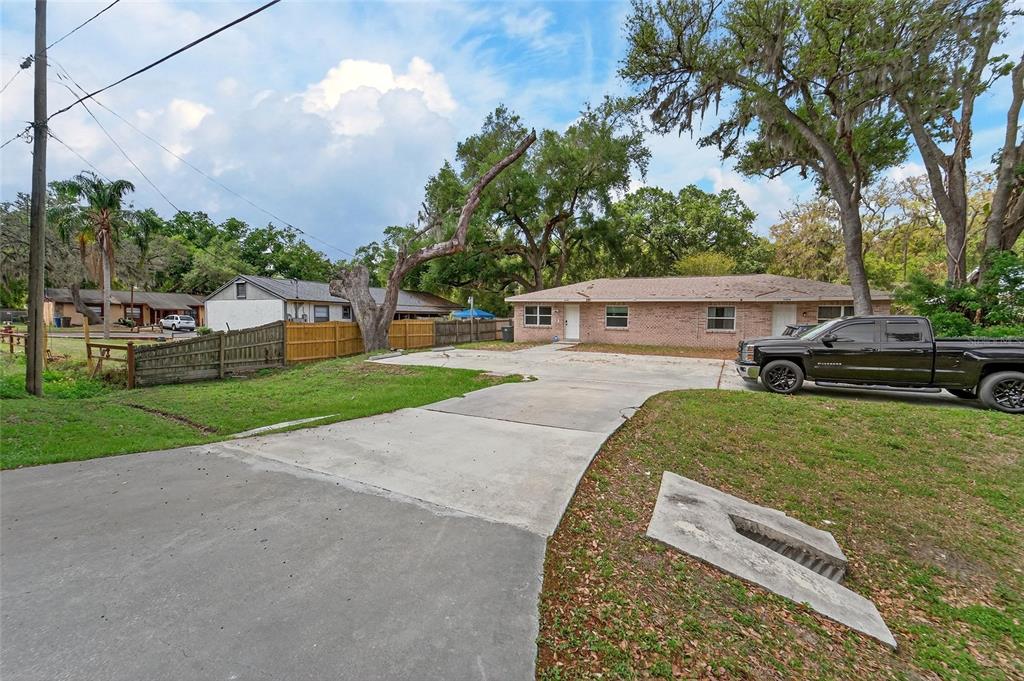 5502 Peach Avenue Seffner, FL 33584 - Photo 11 of 48 a view of a house with a back yard