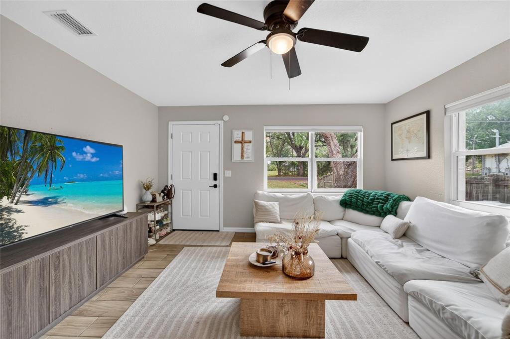 5502 Peach Avenue Seffner, FL 33584 - Photo 13 of 48 a living room with furniture and a flat screen tv